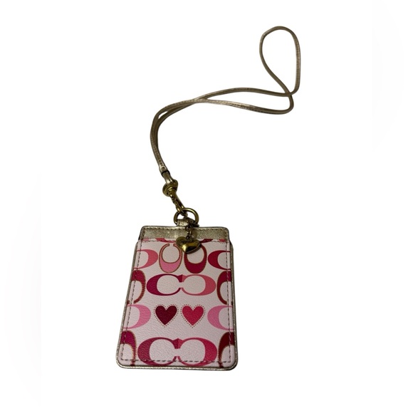 Coach Handbags - Coach Gold ID Holder with Charm.in New condition only have little corner scrabs